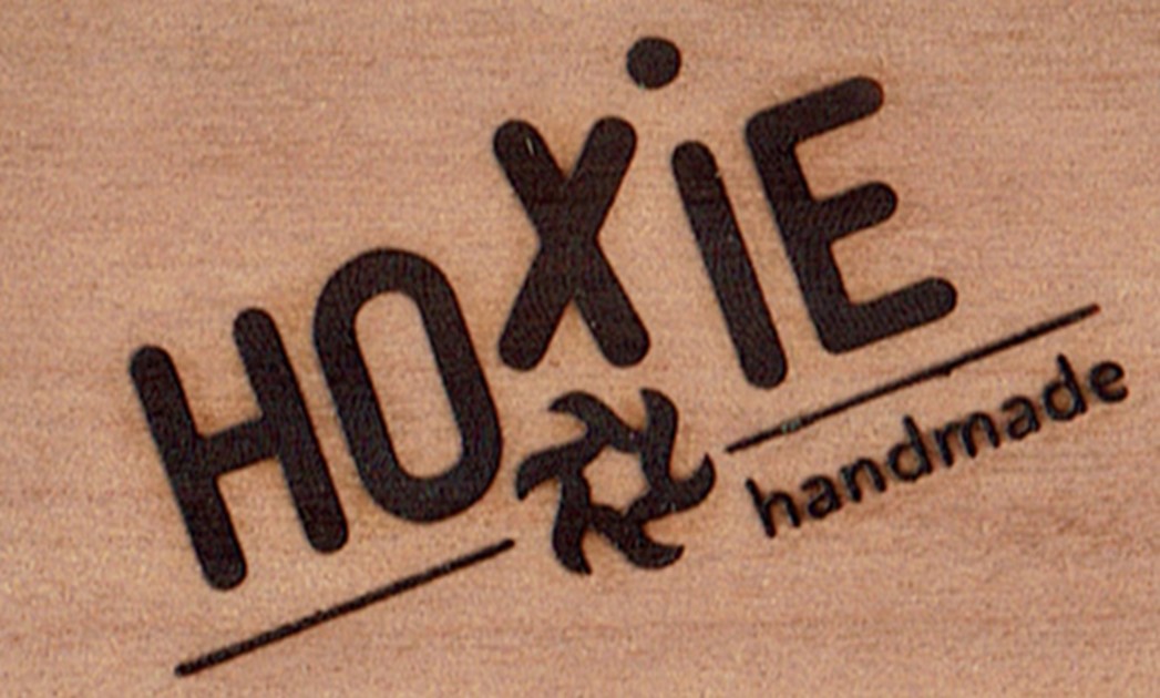 Marks of a branding iron on wood
